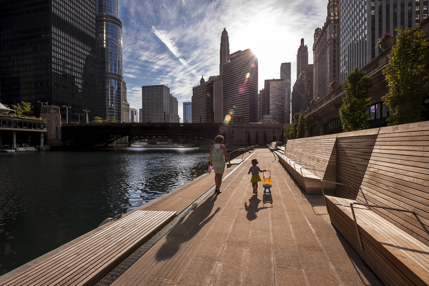 people walking beside a river