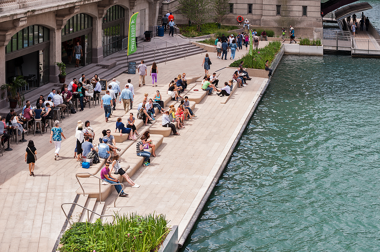 photo of people along riverfront