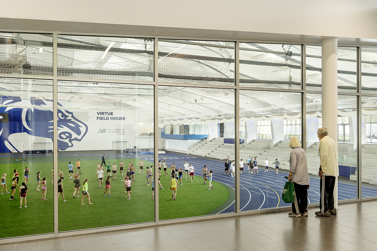 photo of people overlooking indoor sports facility