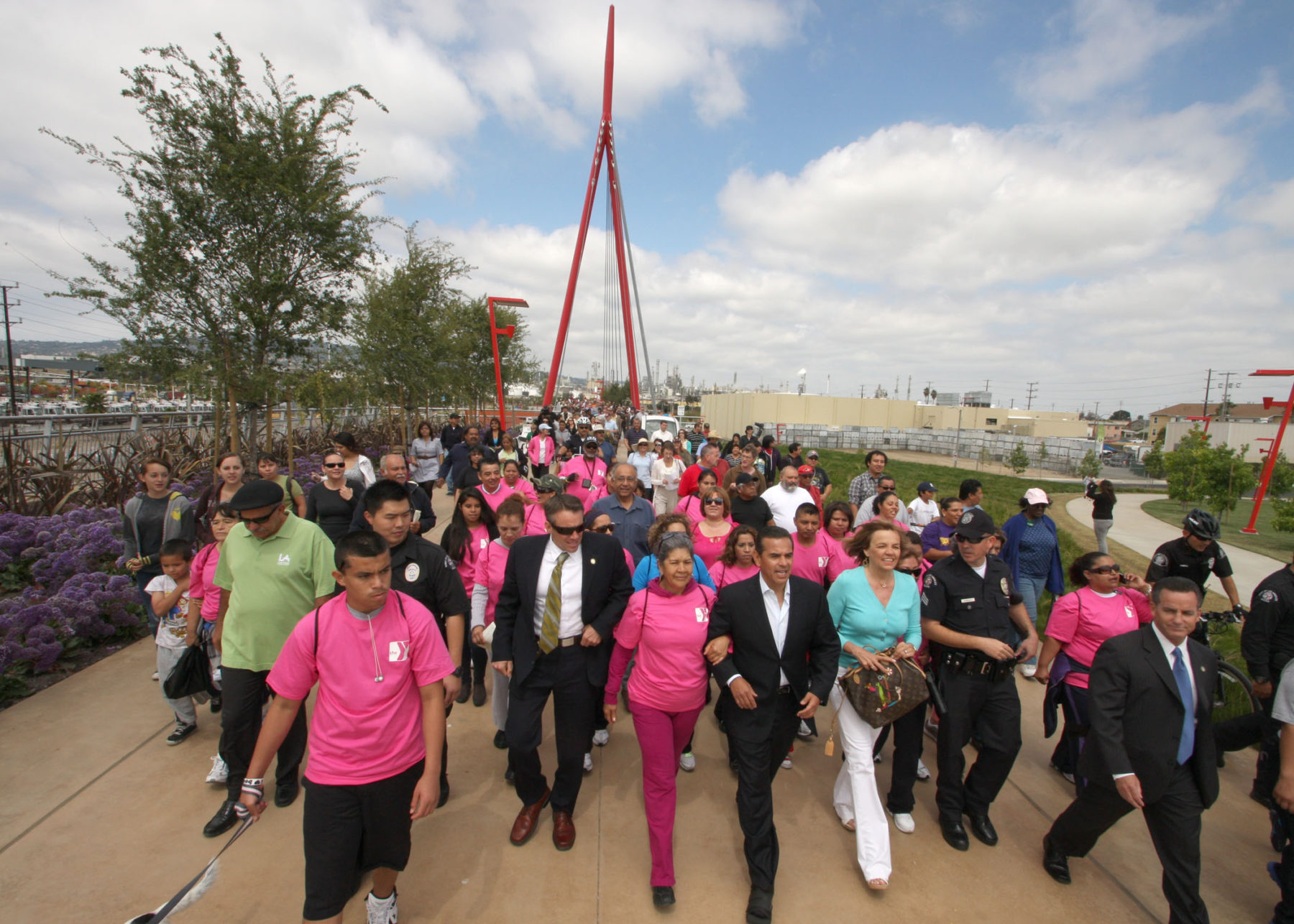 group of people walking together through park