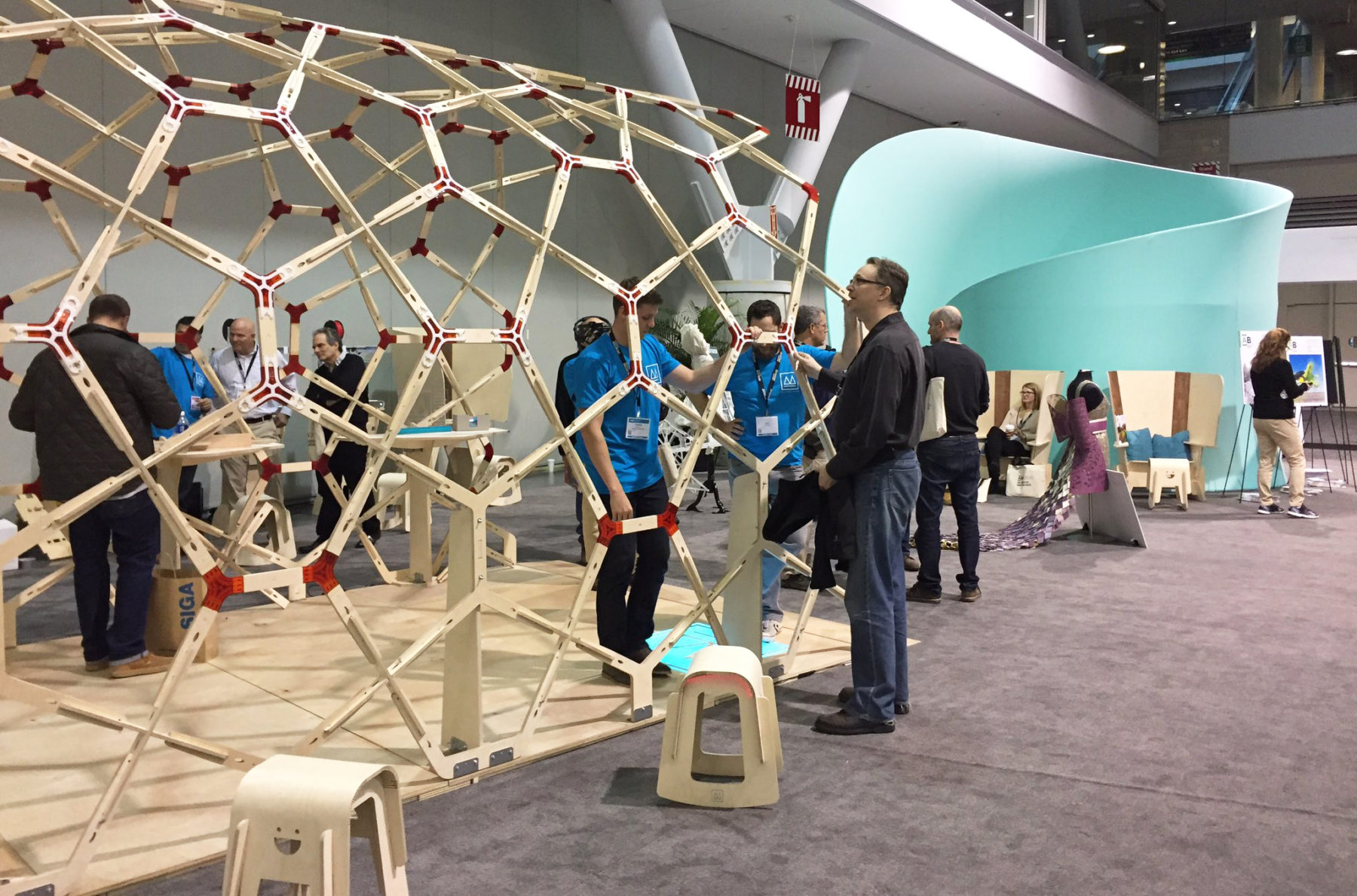 people looking at wooden structure