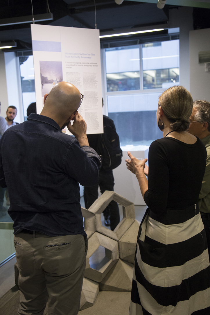 people looking at a display