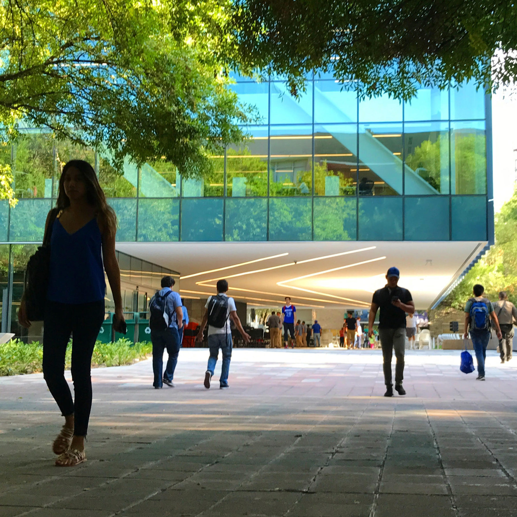 people walking in front of a building