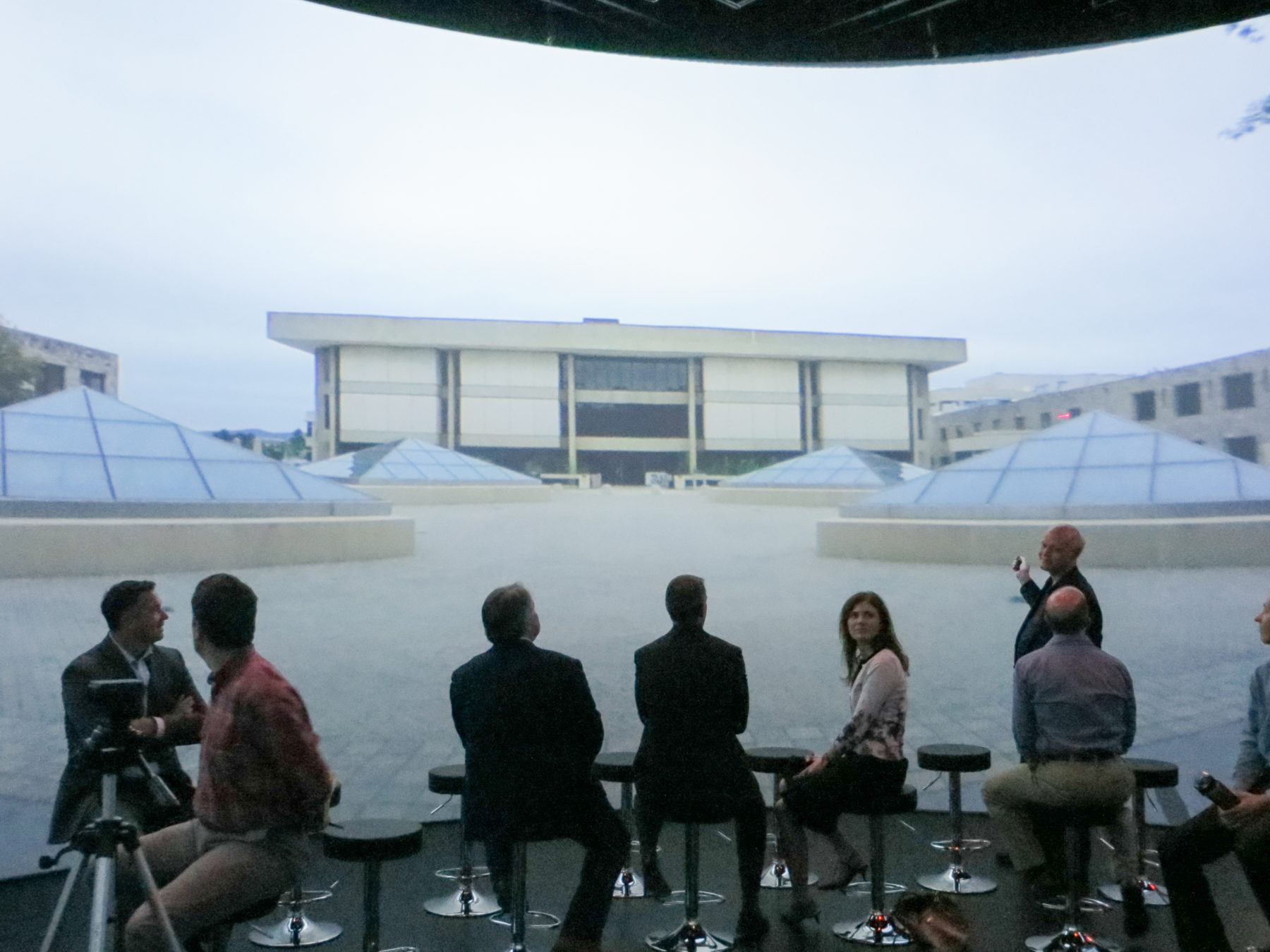 Audience looking at image of roof on screen