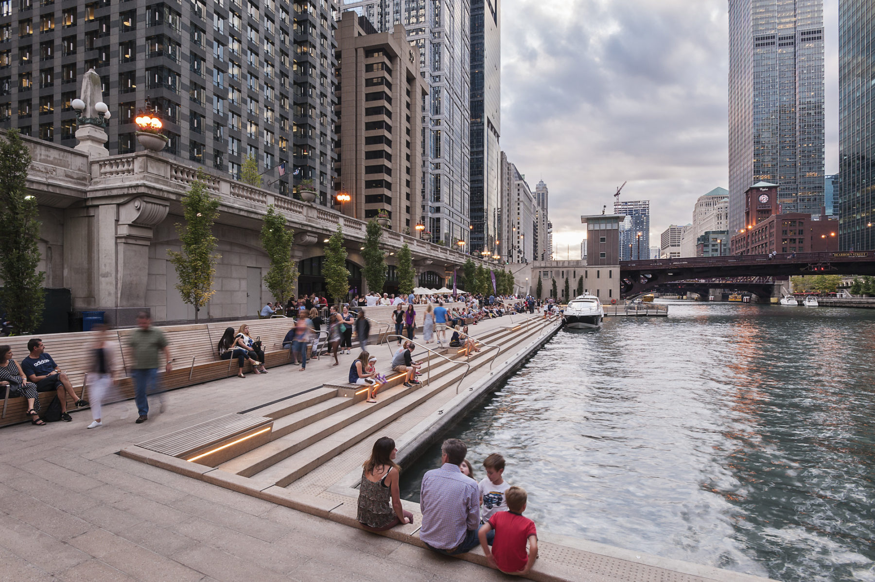 photo of people sitting at riverfront