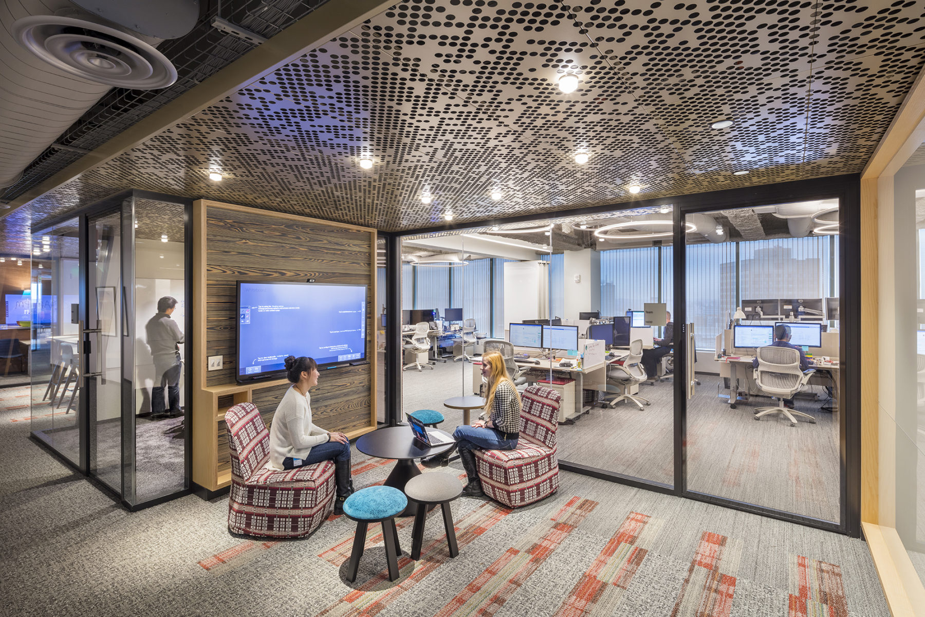 two people sitting in an office nook