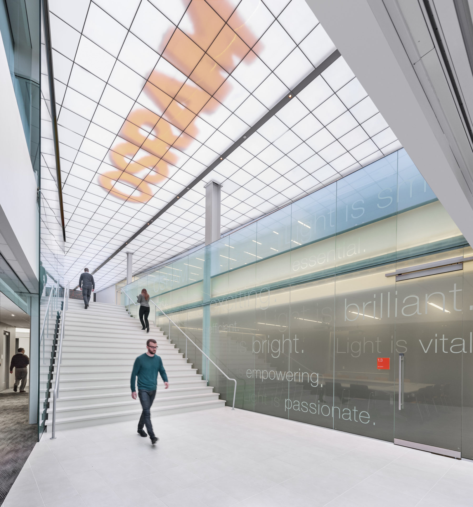 person walking through large office entry