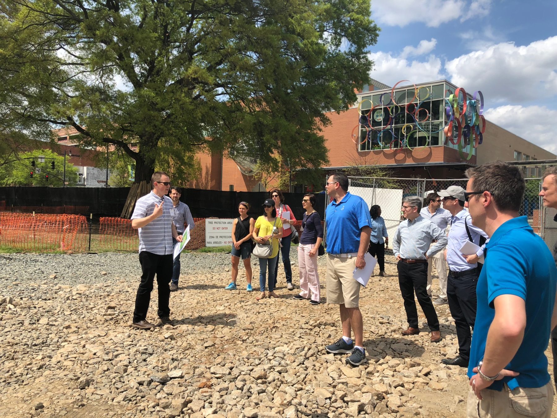 group of people standing at construction site