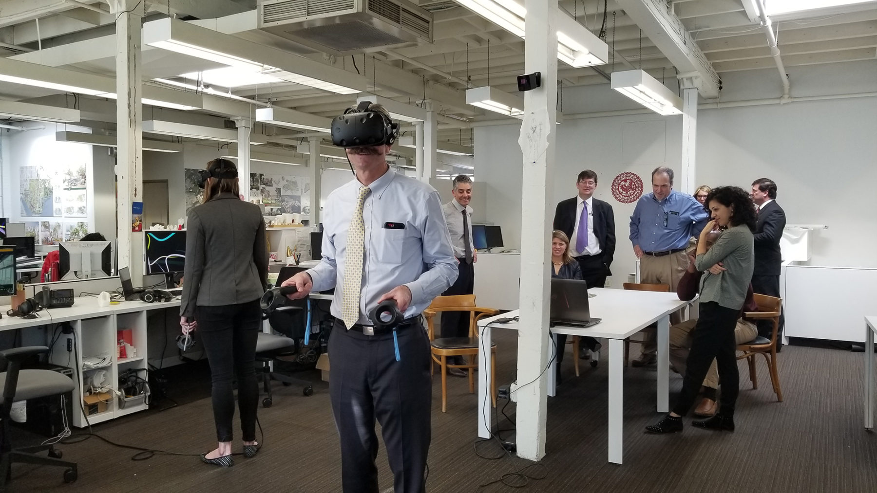 Man using VR headset to view project proposal