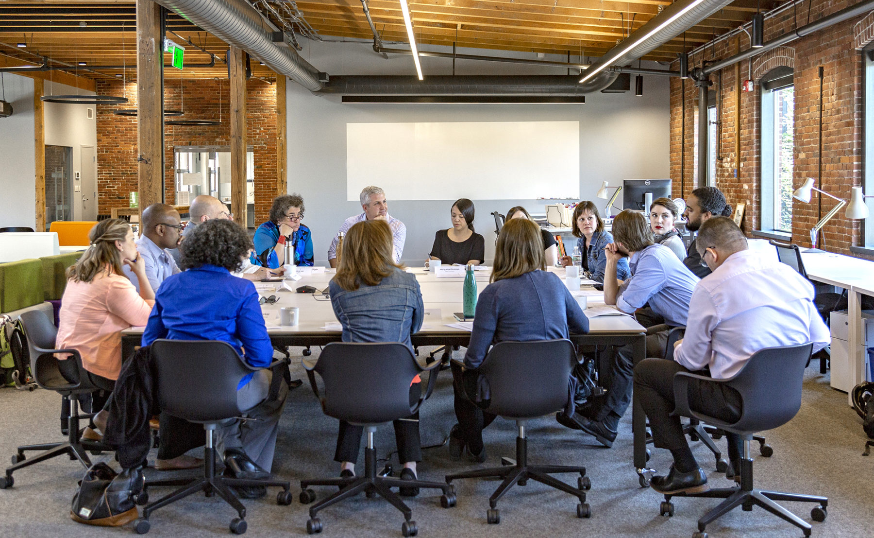 people sitting around a large table