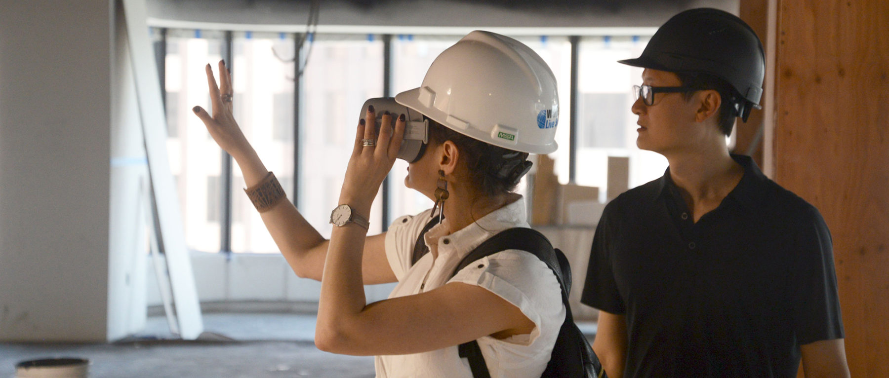 Woman using VR goggles to view design proposals