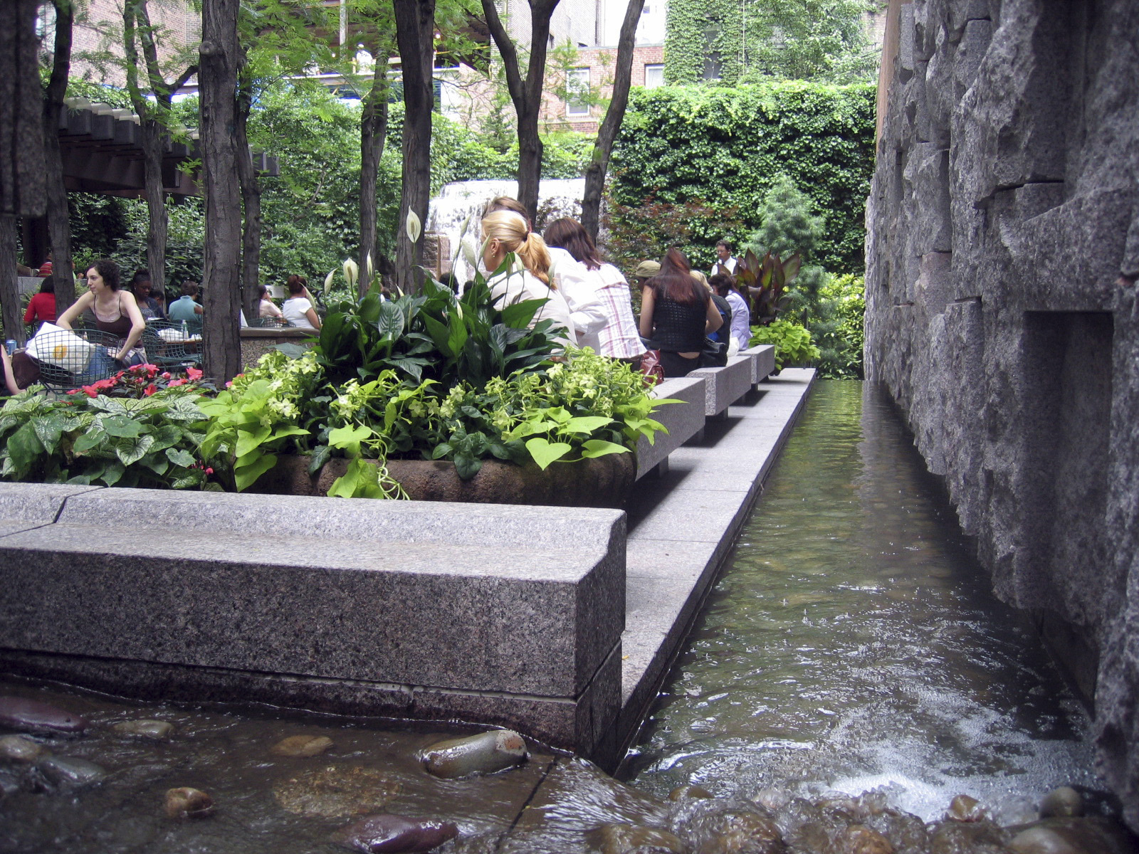 people sitting near water feature