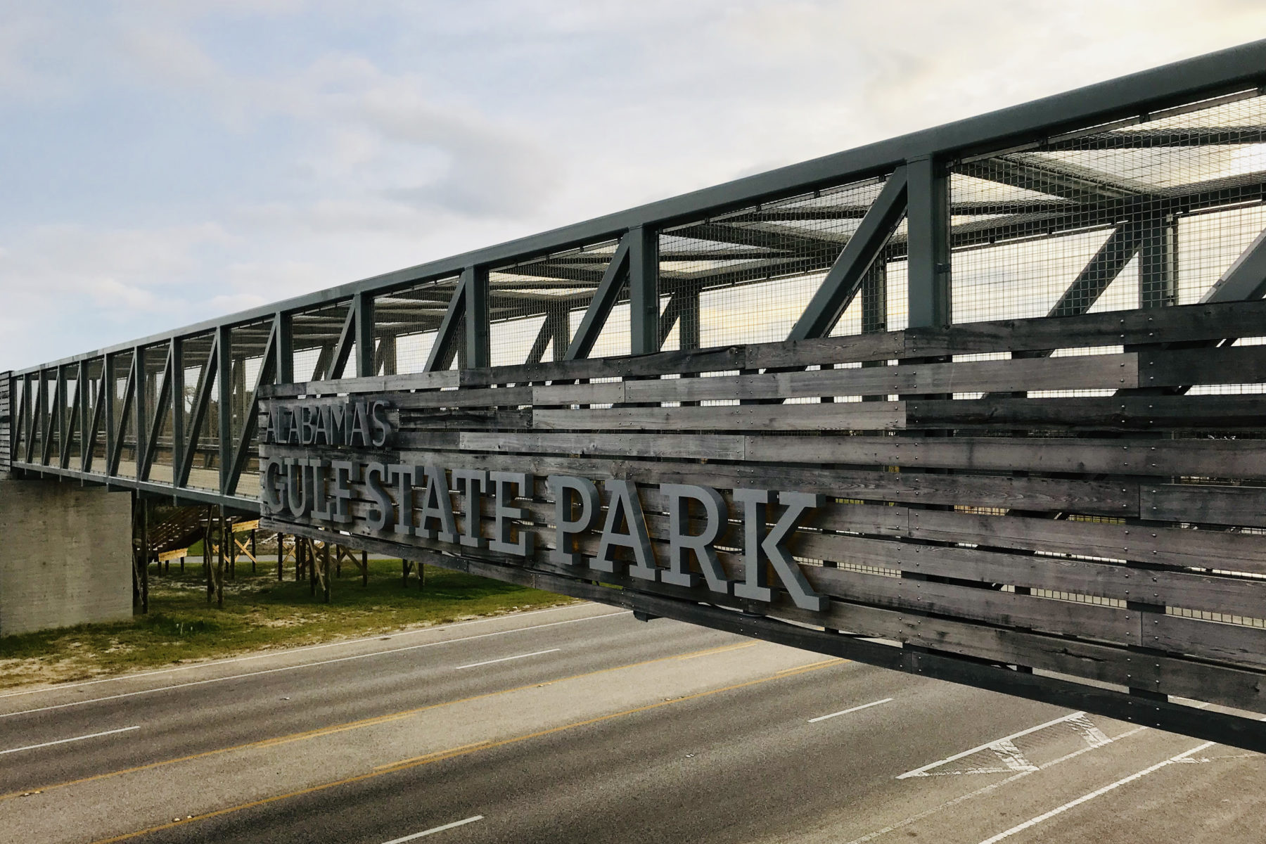 A walkway over a road at Gulf State Park