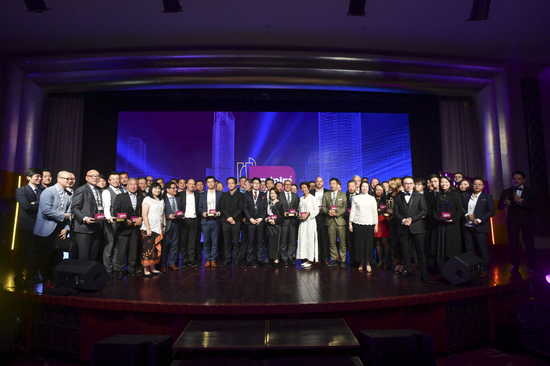 A group celebrates the awards