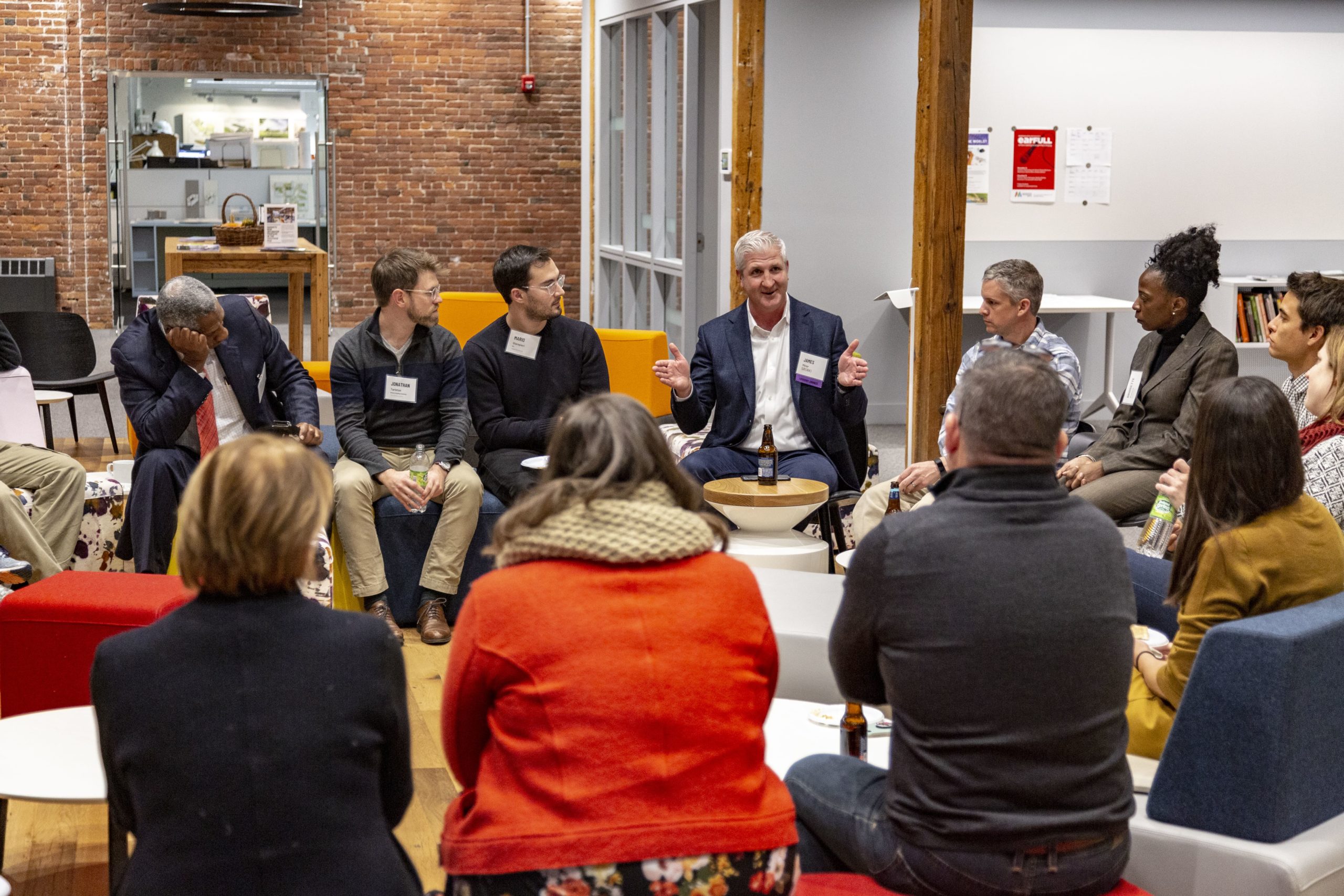 Group of people sitting together having a discussion