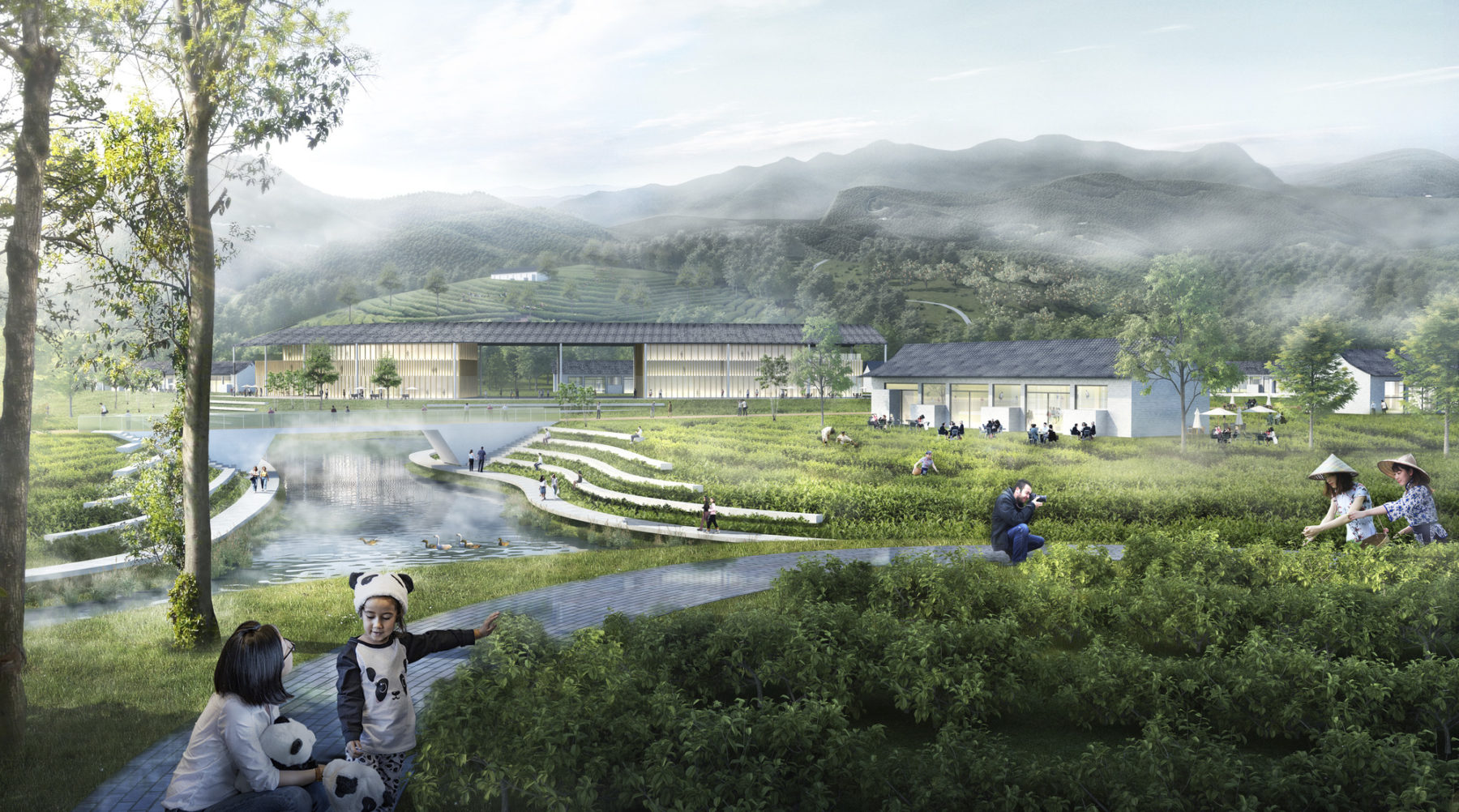 Woman and child sit atop a grassy field overlooking the Chengdu Panda Preserve