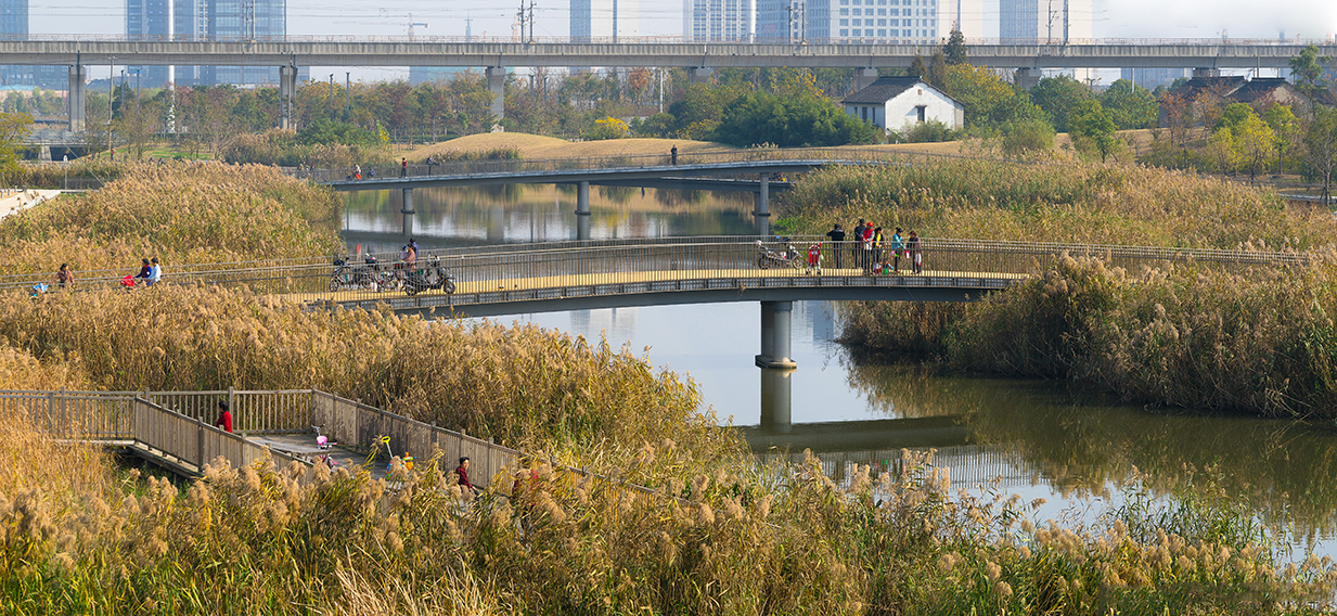 People walking along bridge