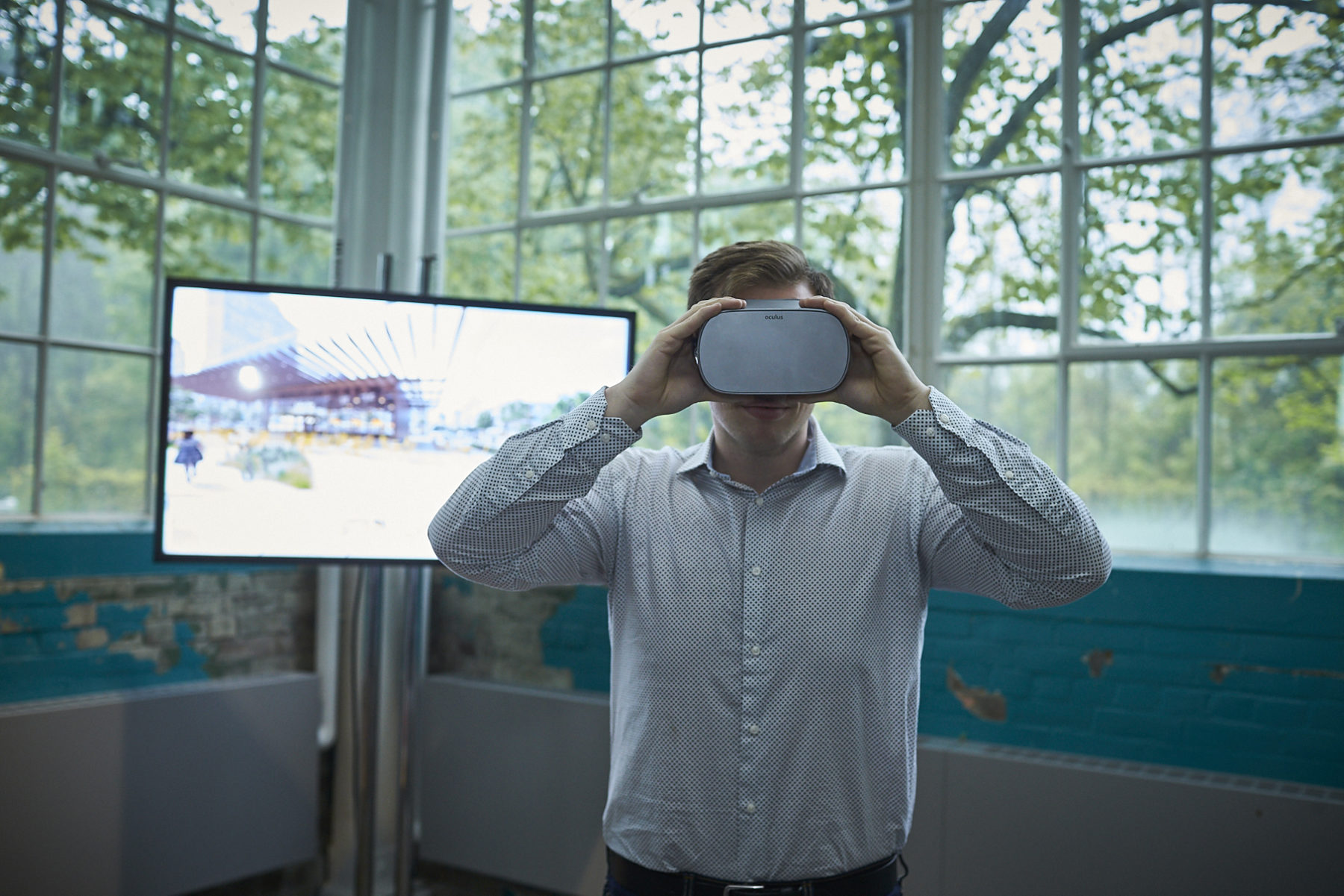 Man looks at future plan through virtual reality (VR) goggles