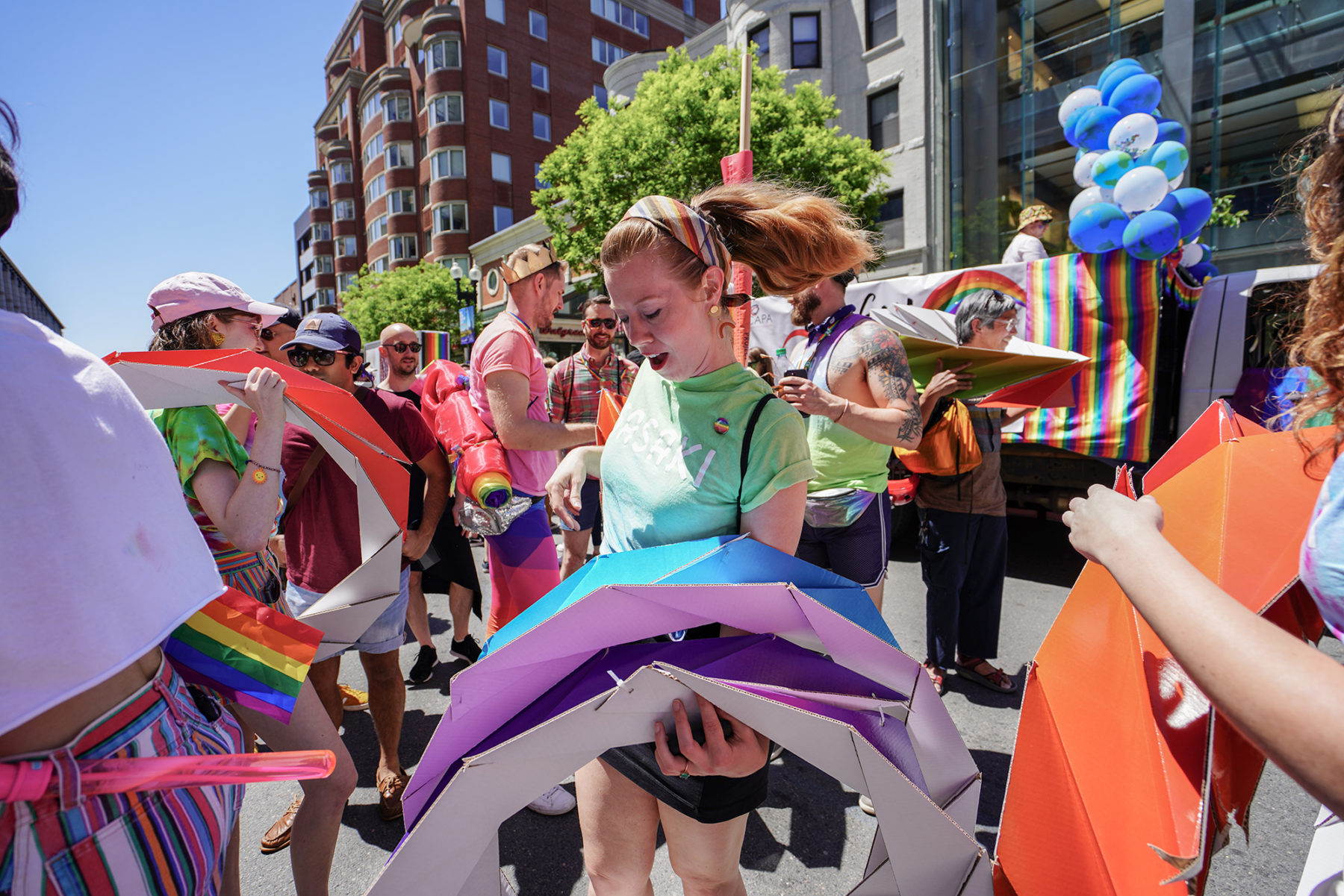 Woman holding parade props outside at the event