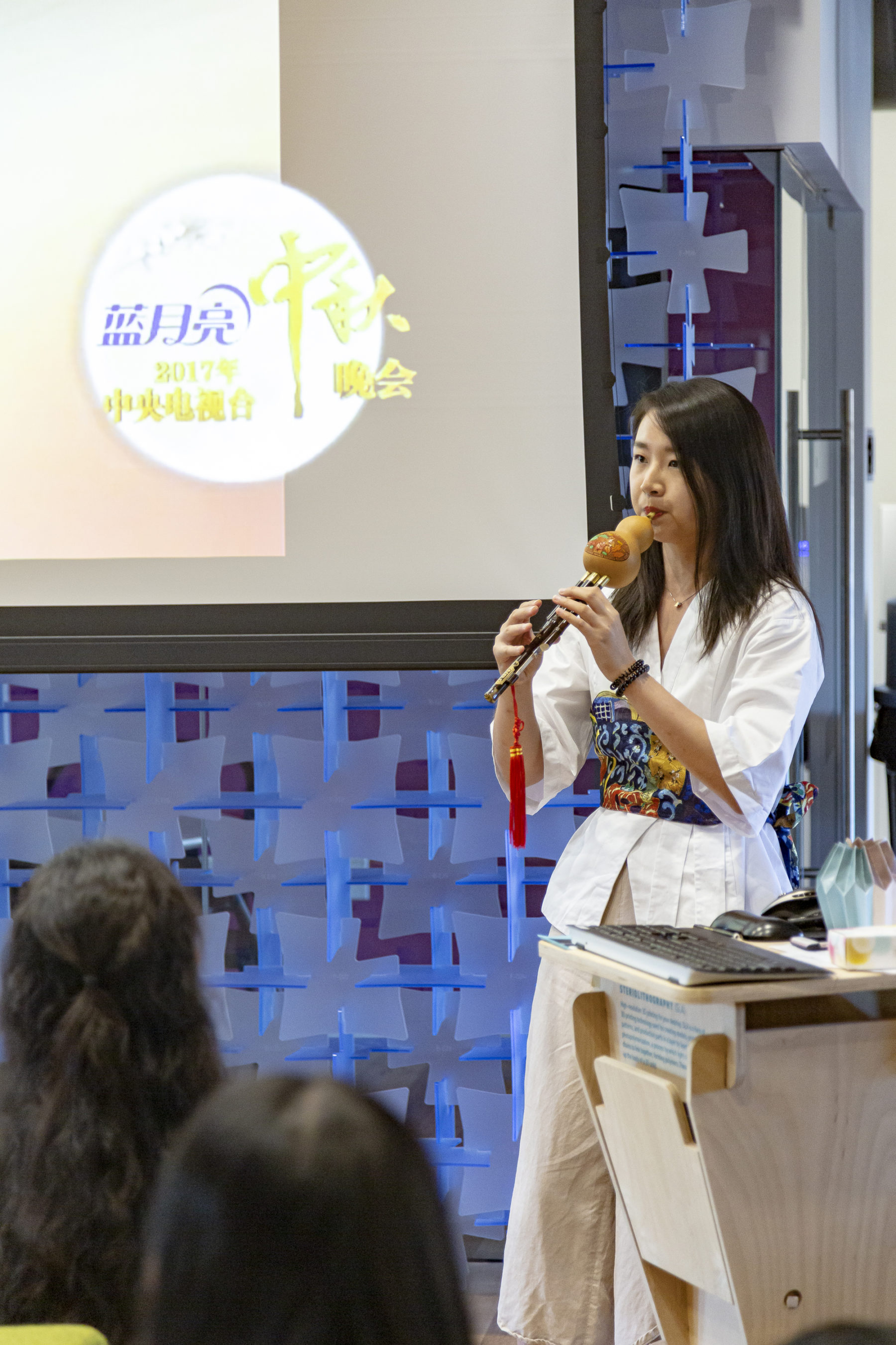 Woman playing Chinese gourd flute