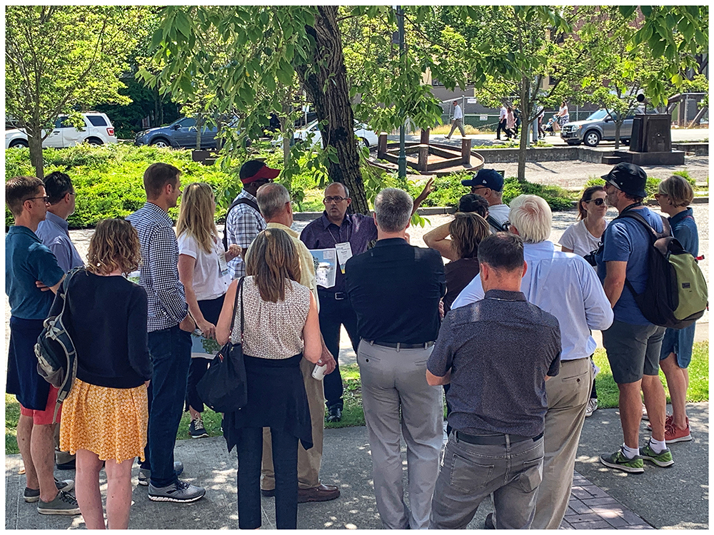 Romil Sheth addresses SCUP attendees during a tour of the University of Washington campus