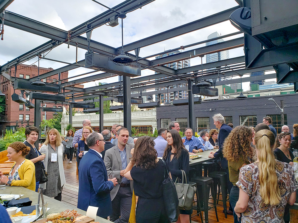 Sasaki designers, clients, and peers enjoy evening conversation on Terra Plata’s roof deck in Capital Hill.