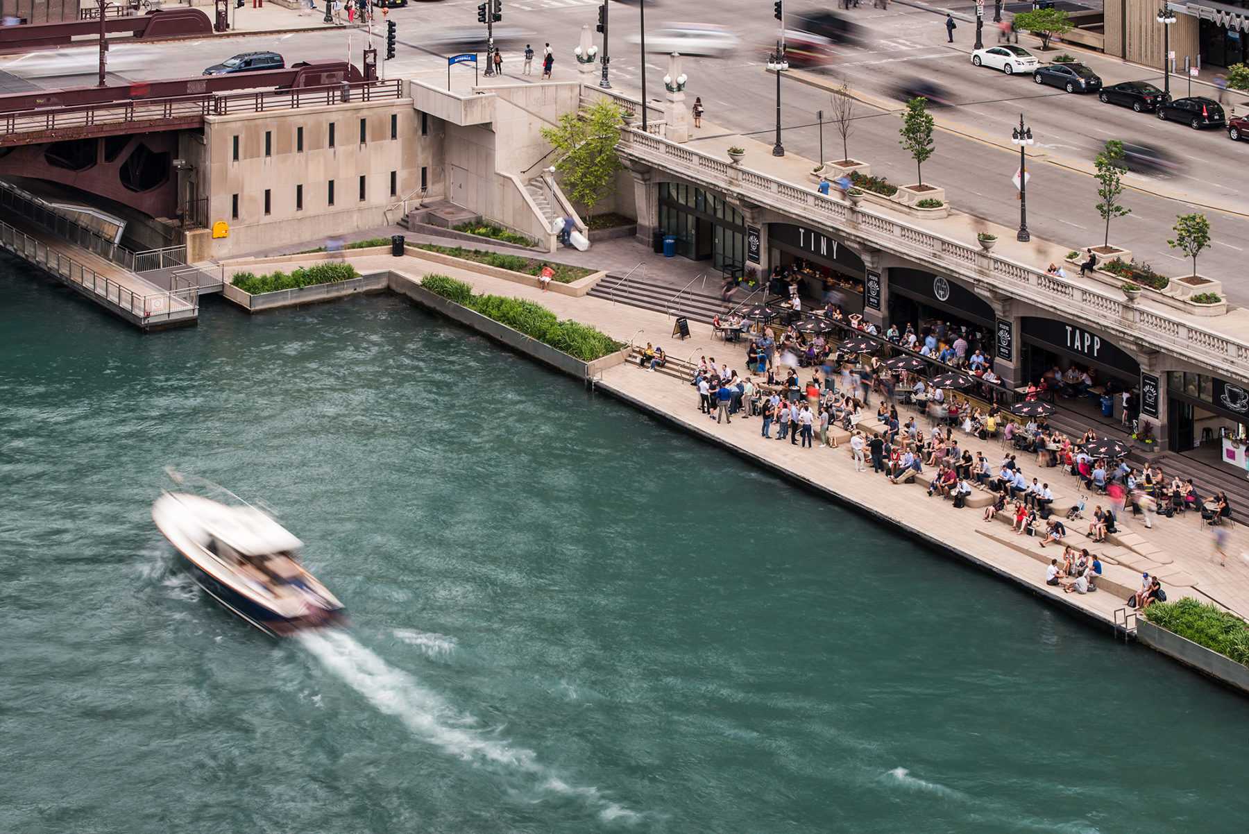 Image of boats and people on chicago riverwalk