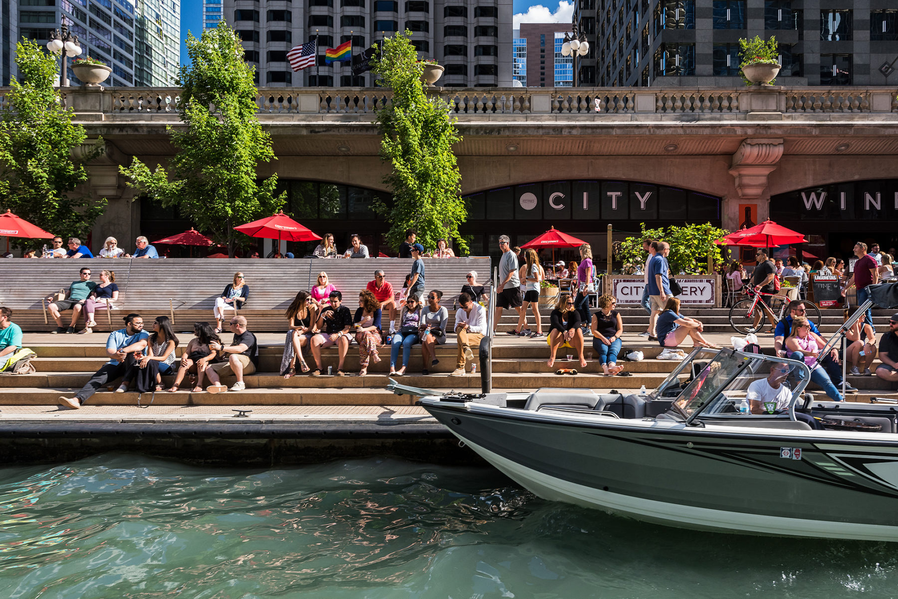 people sitting on stairs at riverwalk