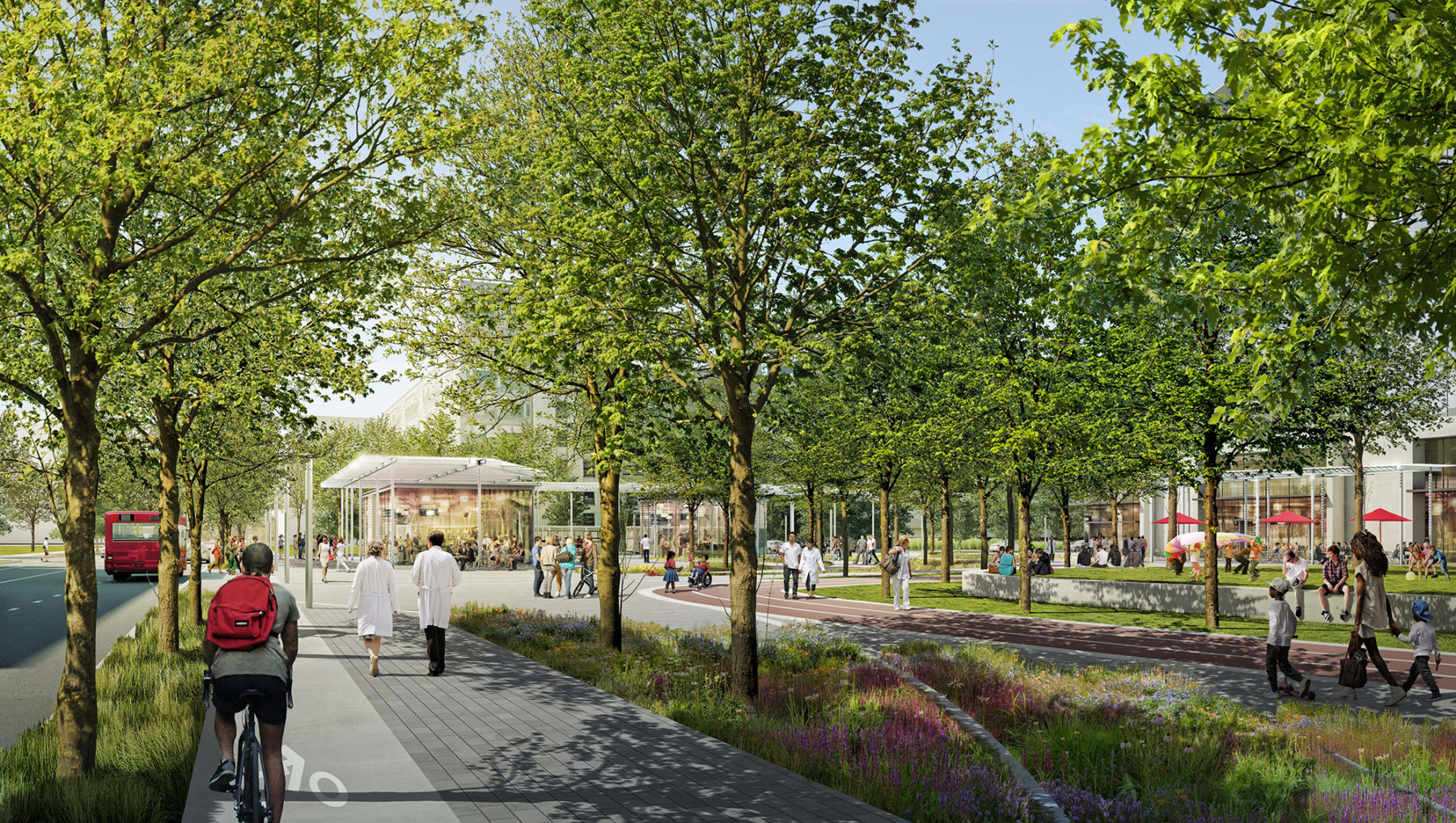 Medical staff and pedestrians walking through a medical campus lined with trees