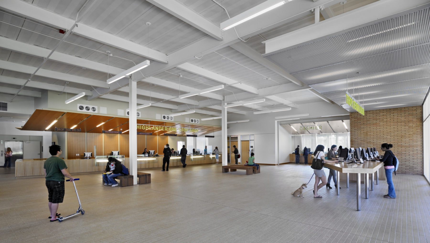 Interior photo of students scattered across the main service area