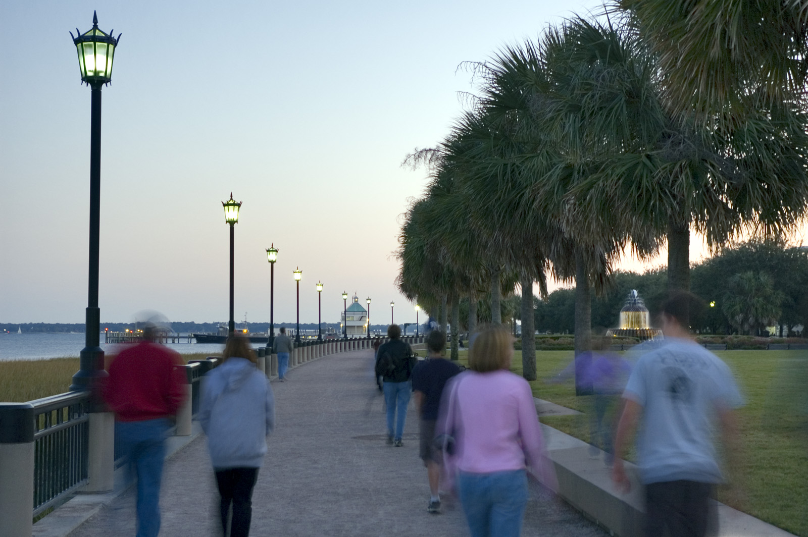 Photo of people walking along the waterfront path in the park