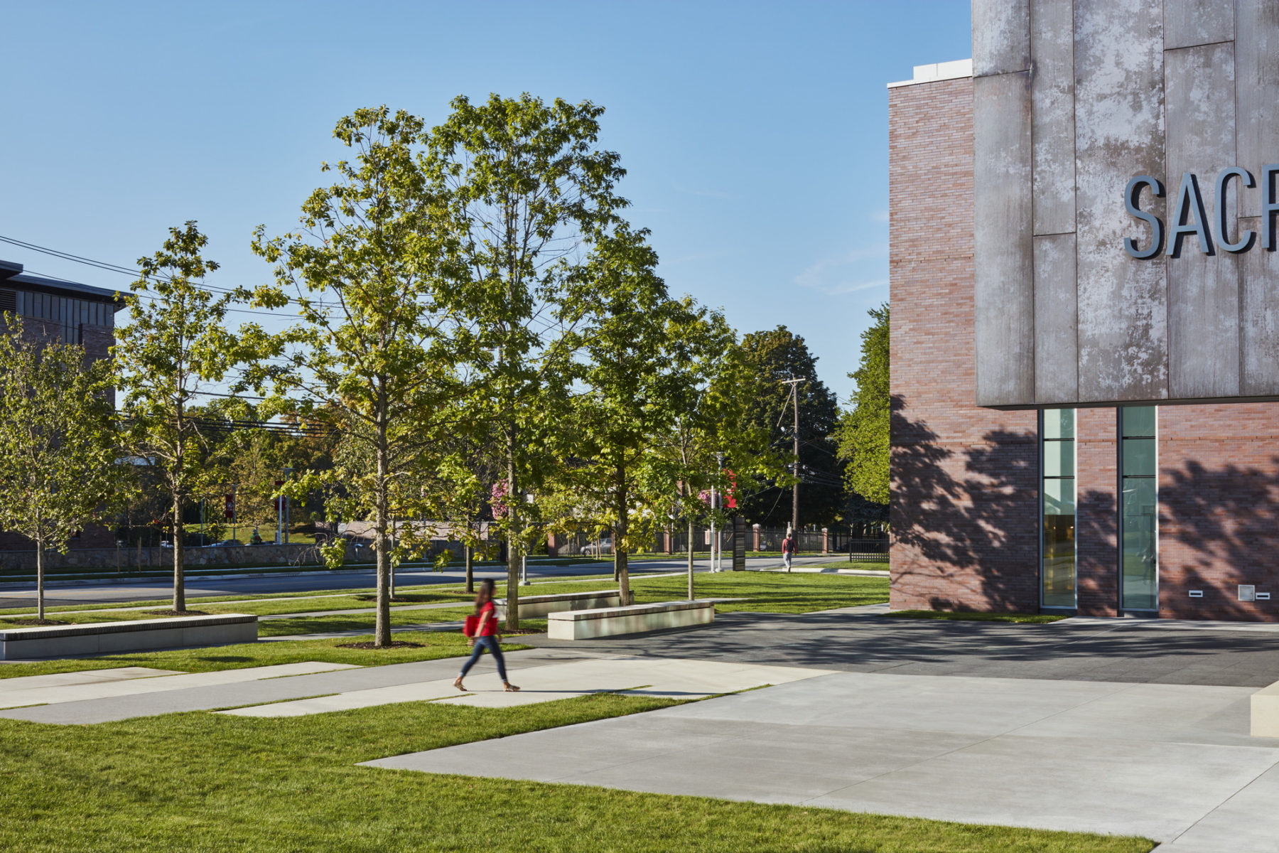 a person walks across the lawn