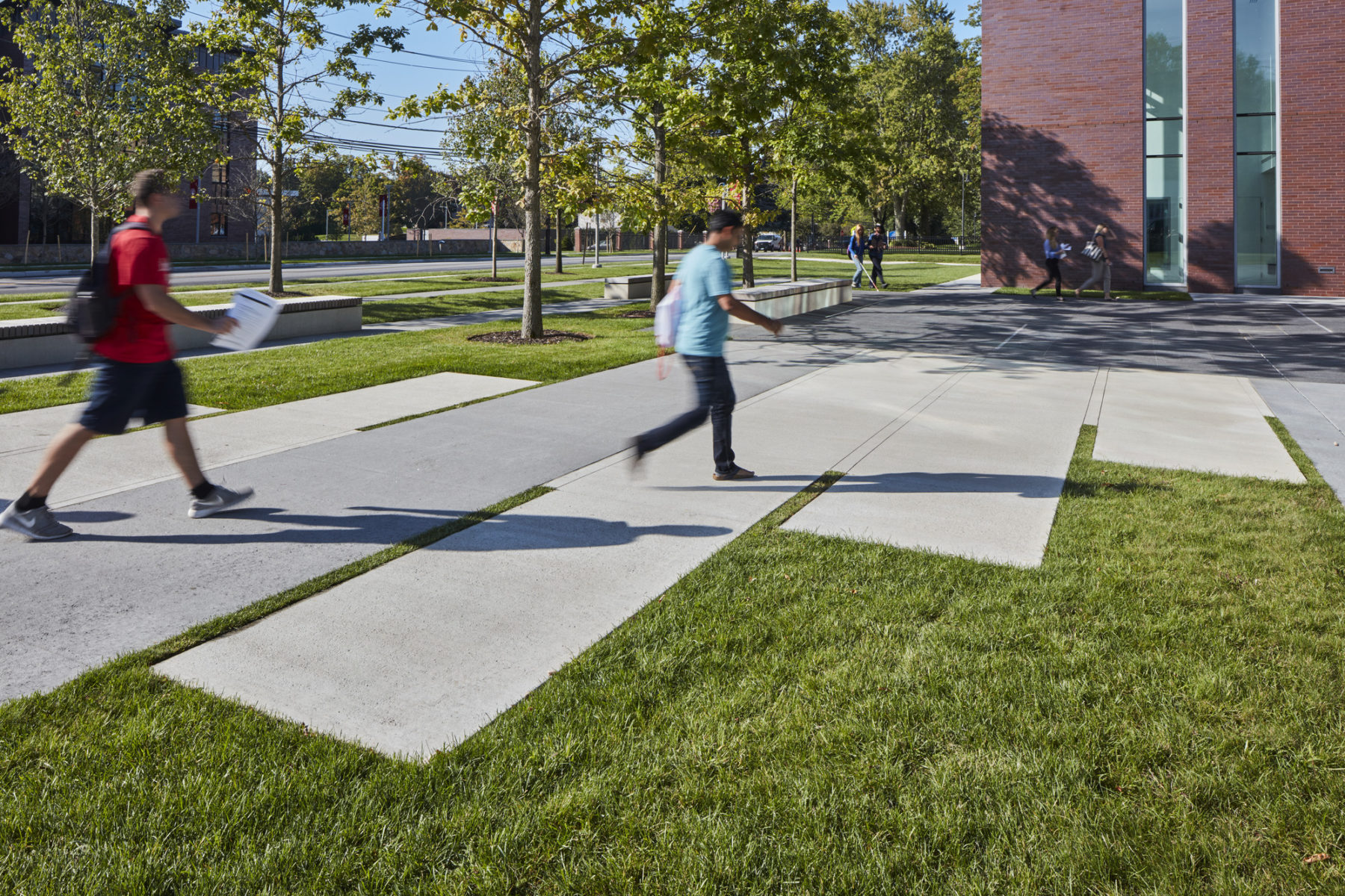 people walking across campus