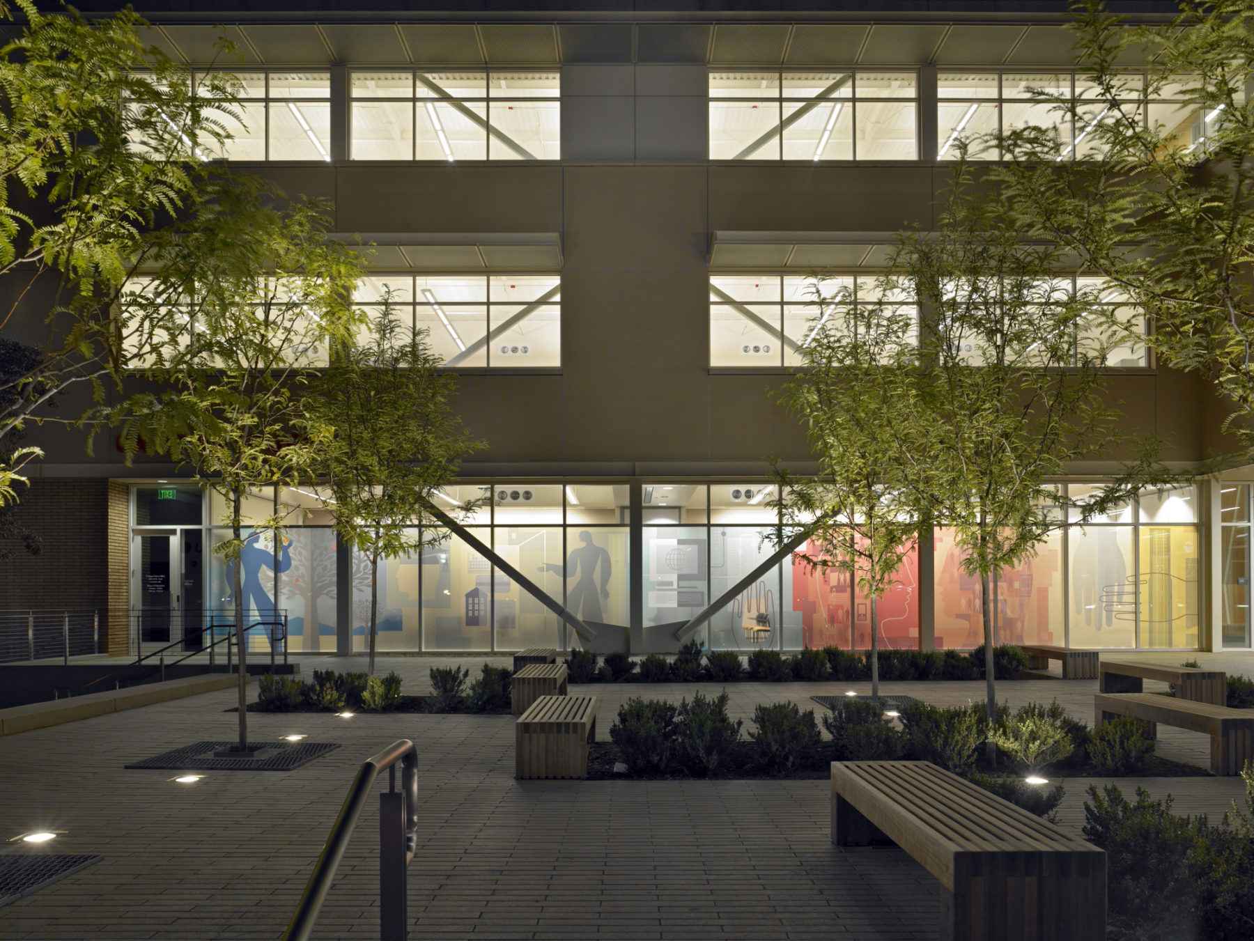 Exterior photo at night looking into the building