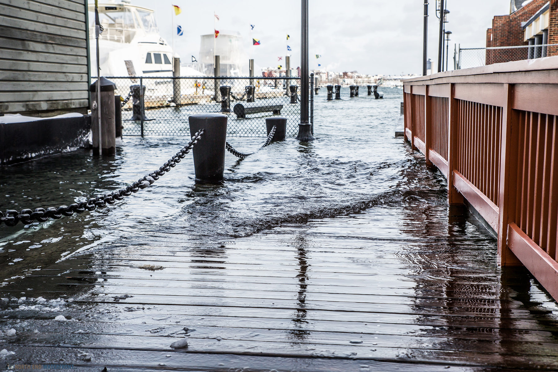 photo of water washing onto a dock