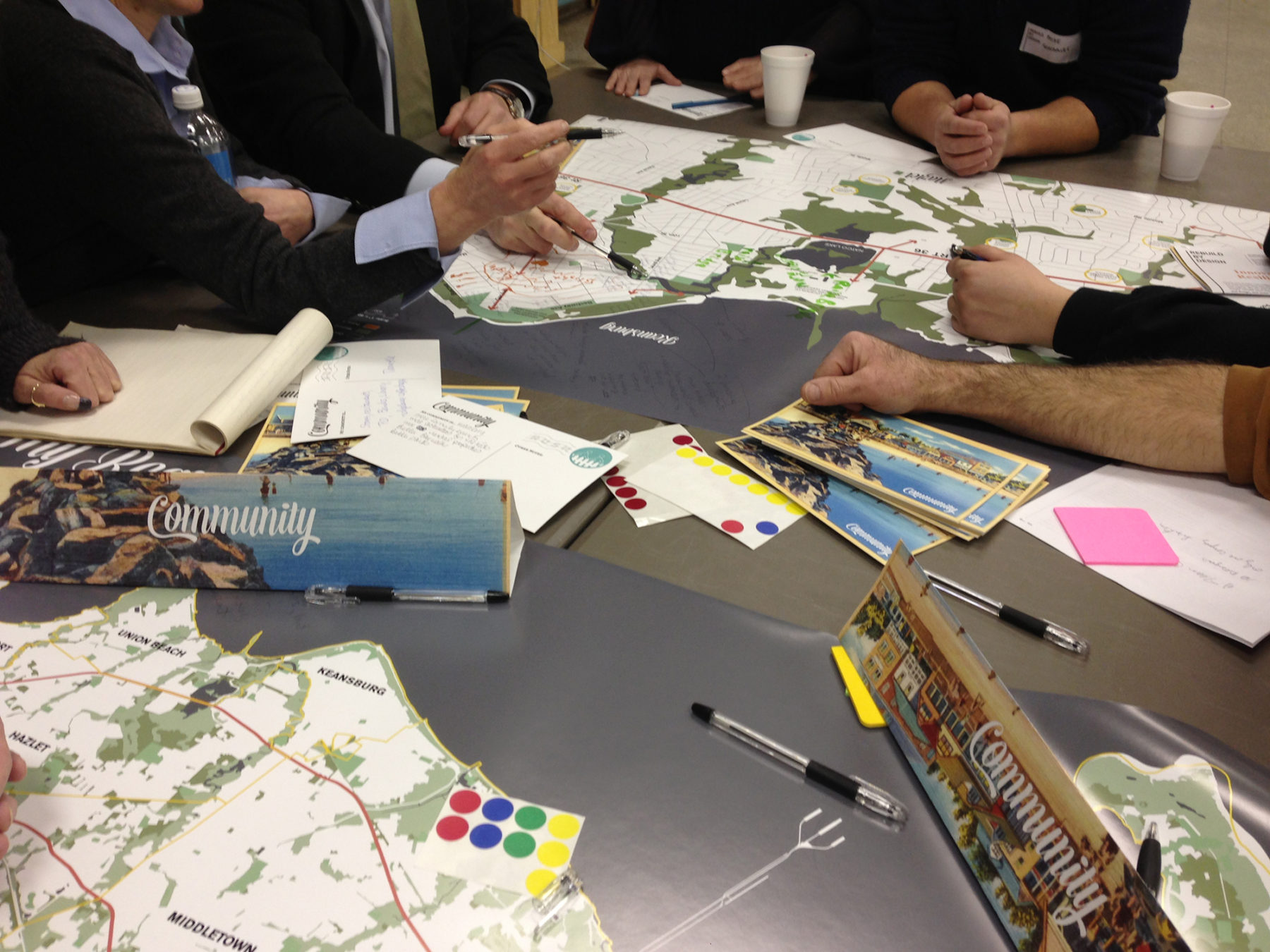 Photo of people drawing on a plan at a community workshop