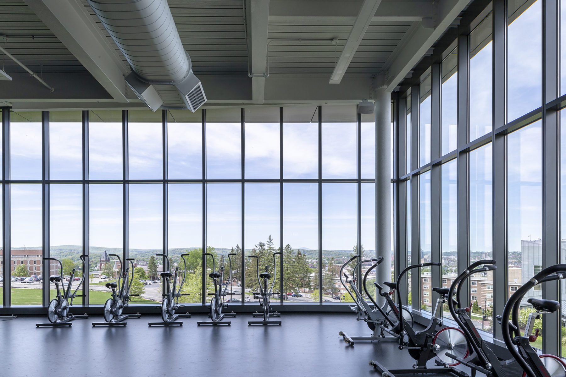 exercise machines next to glass windows