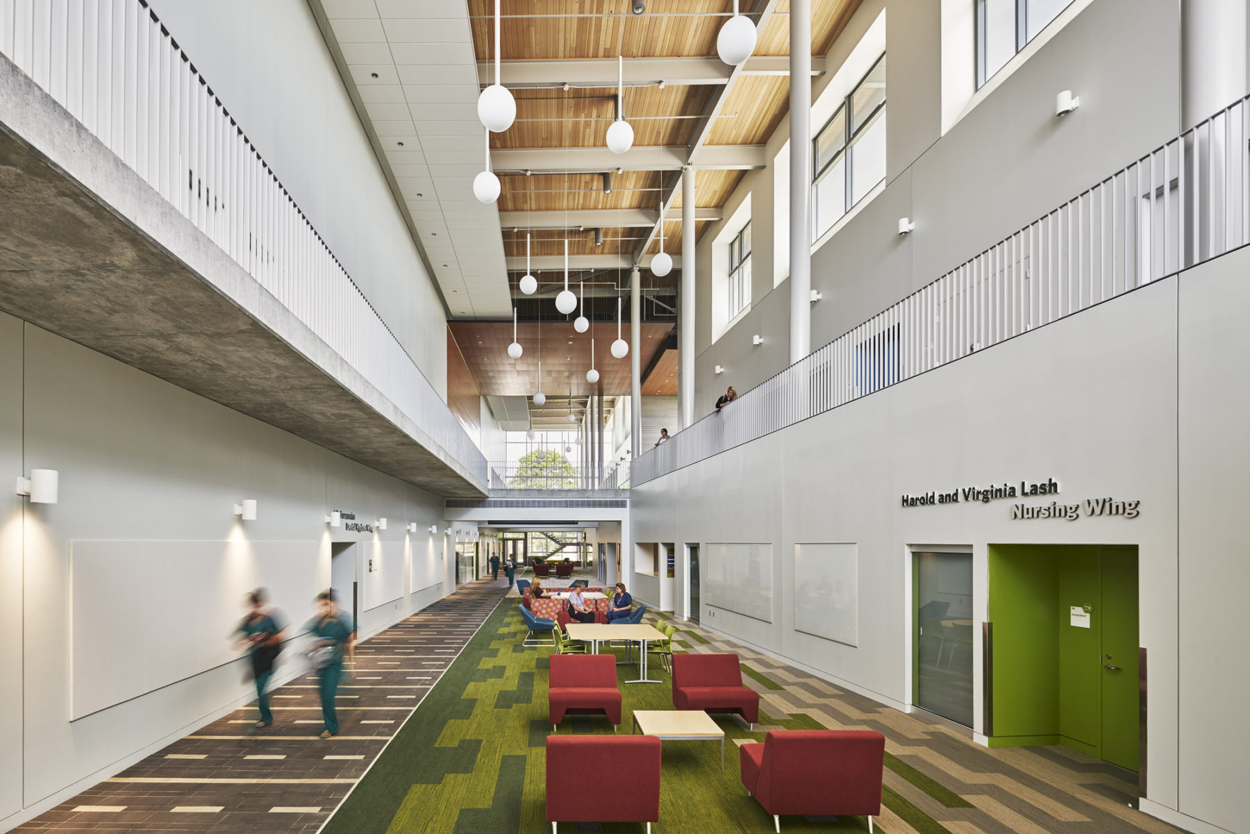 Image of interior with people walking through central corridor