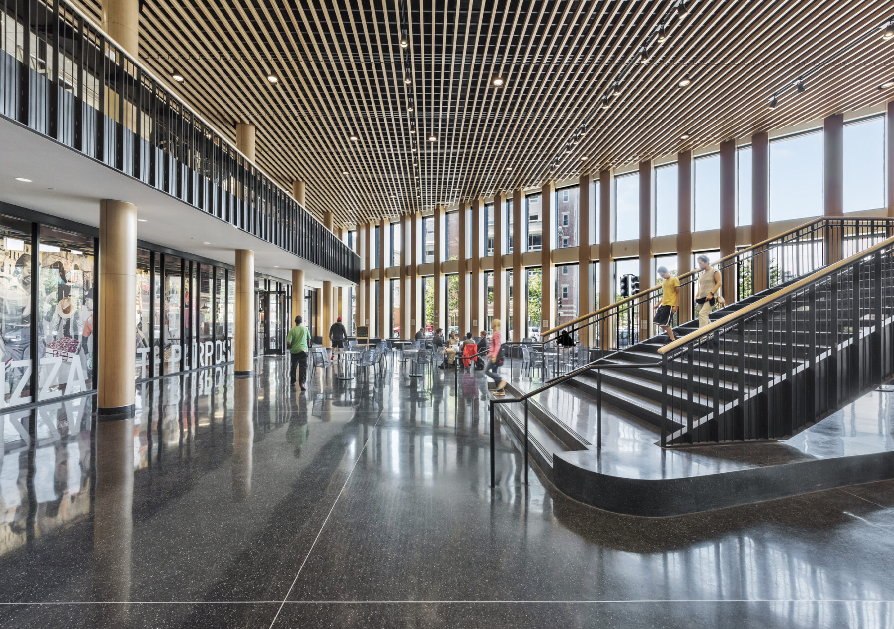 lobby of building with people in it