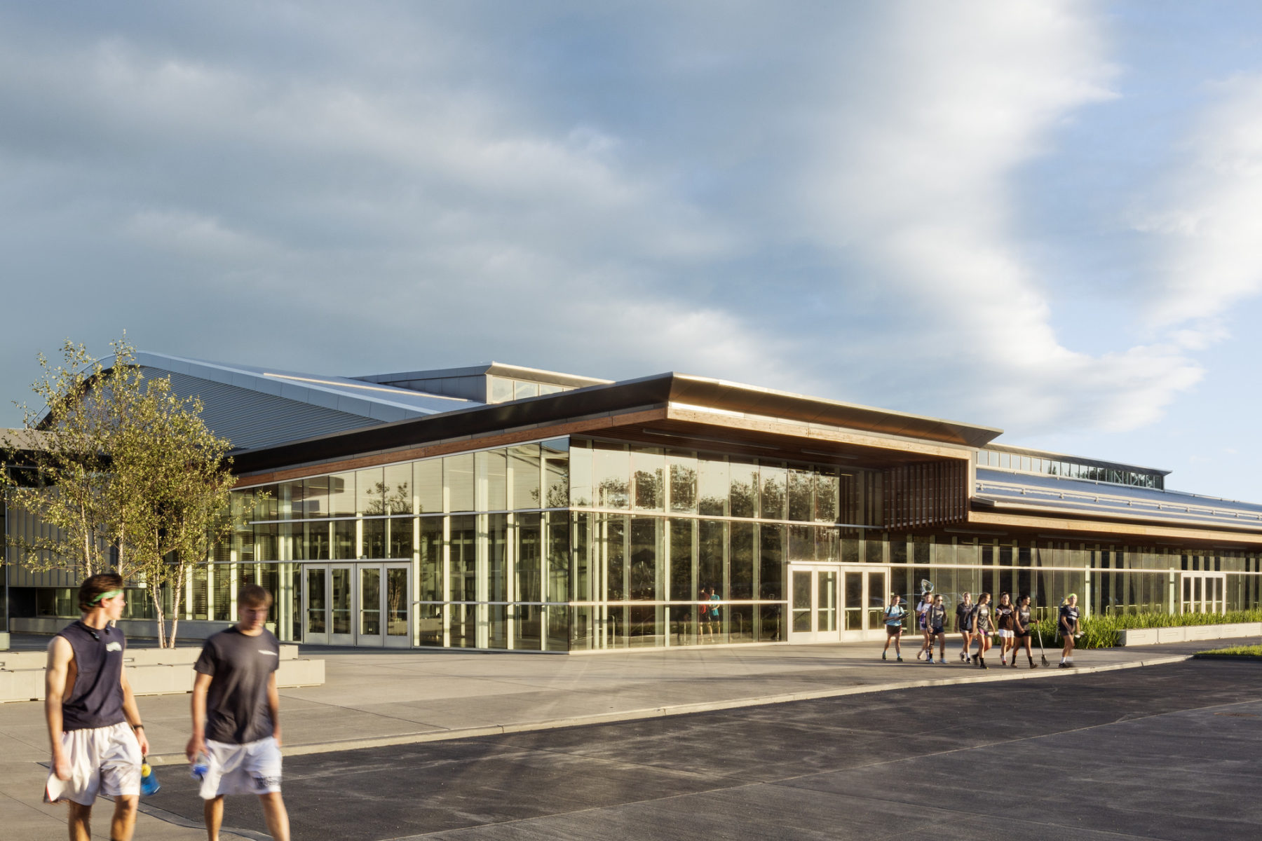 exterior of entryway with two people walking by