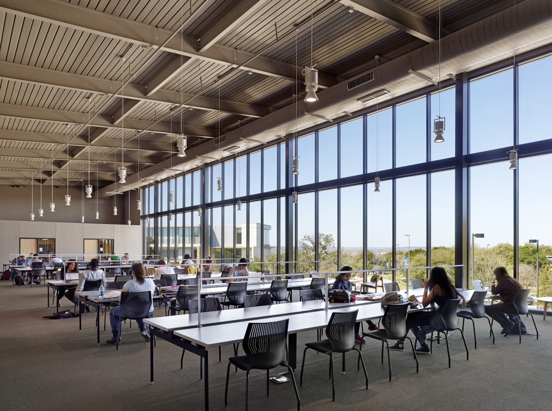 photograph of study room with students working at tables