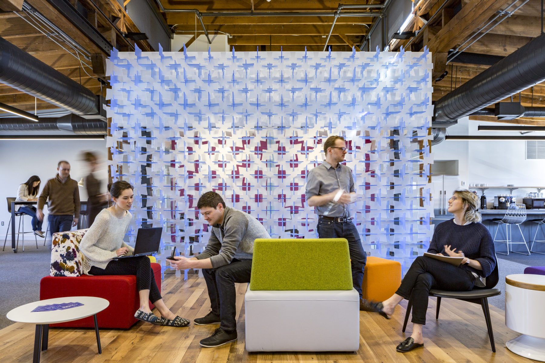 people sitting and working in common area