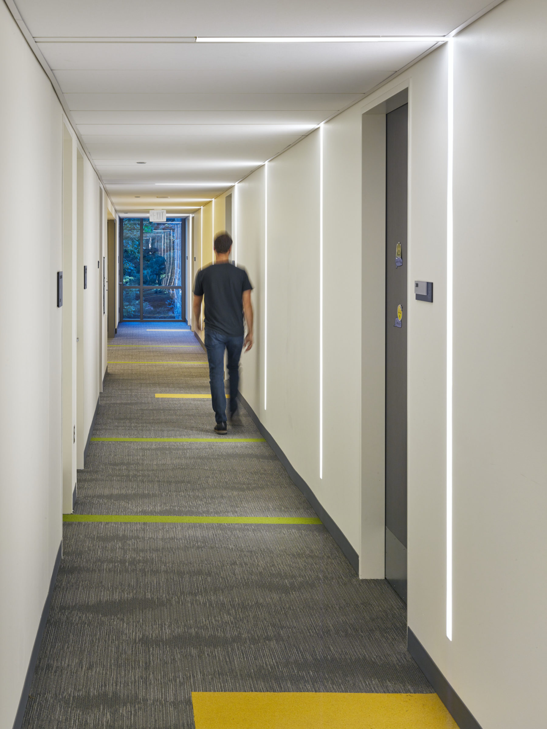 Person walking down a hallway
