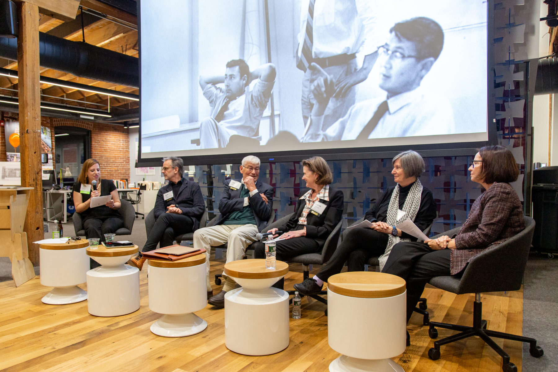 Panelists sitting on stage at Hideo Sasaki's 100th birthday celebration