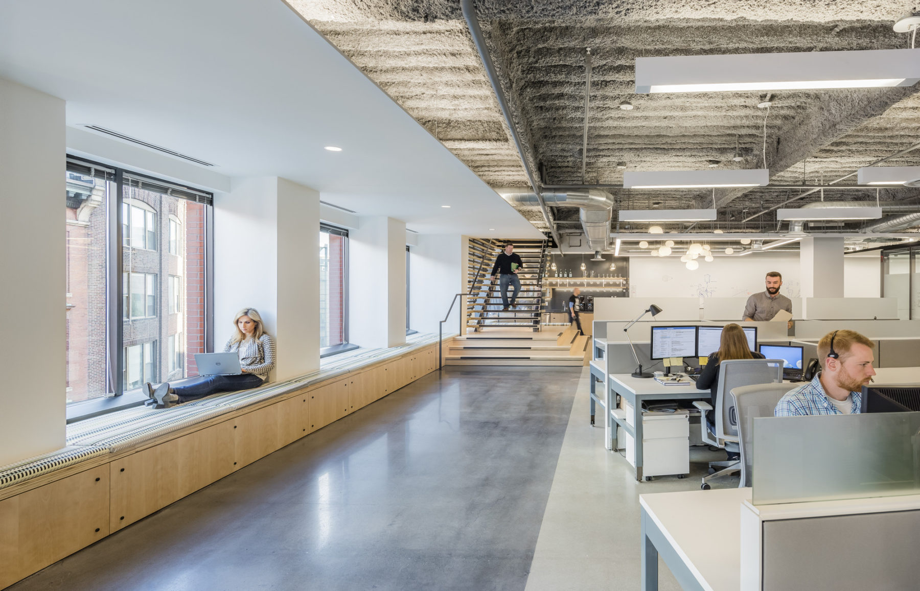 Another angle of downstairs communal area, thise time highlighting open office space towards the left side.