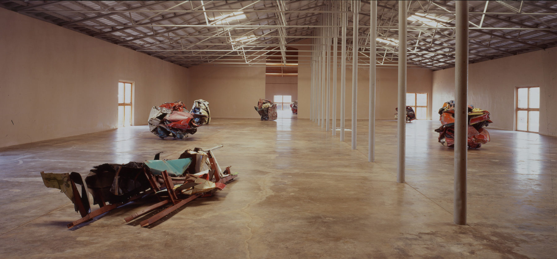 Interior view of gallery space with sculptures..