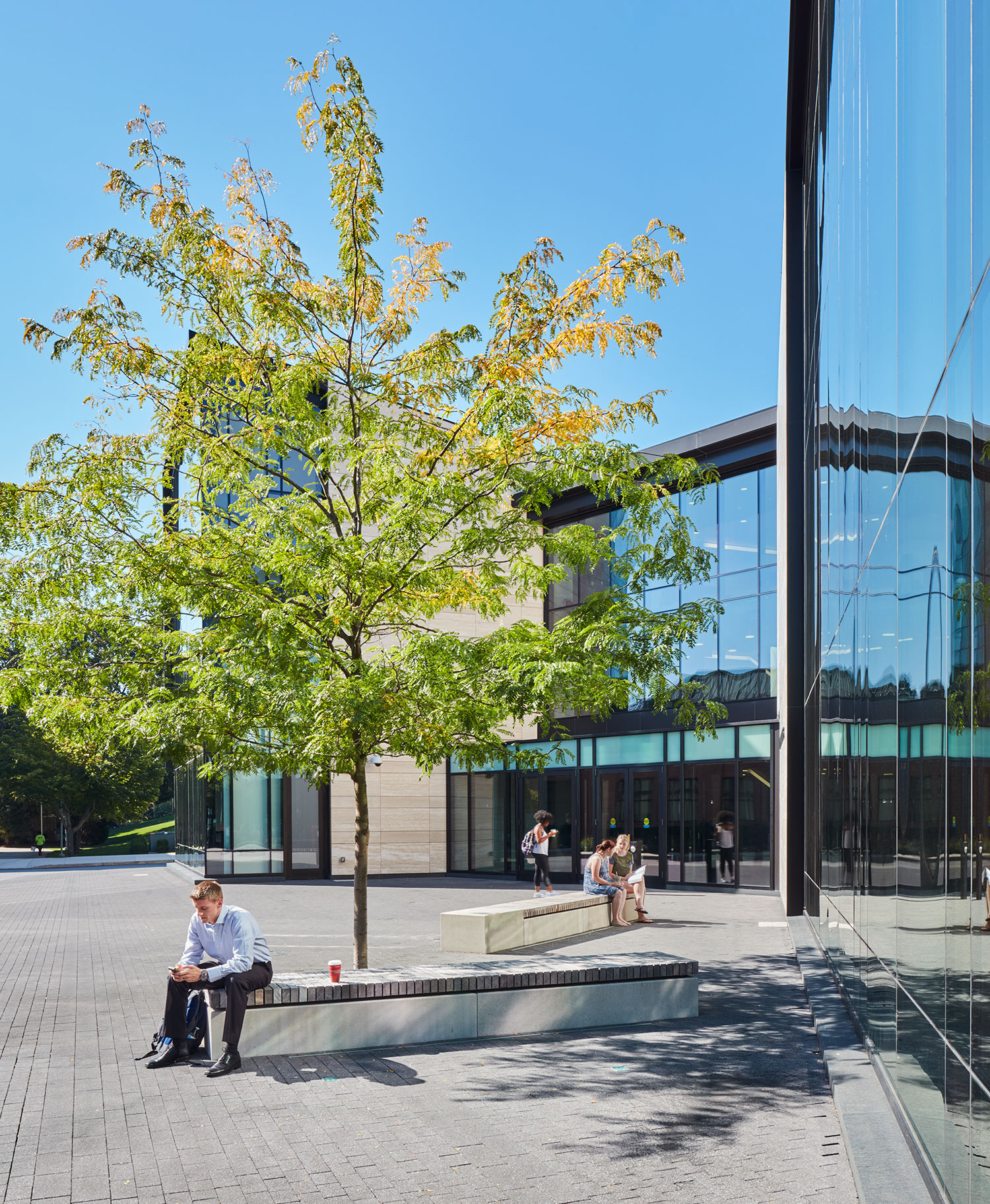 a person sitting outside of a building