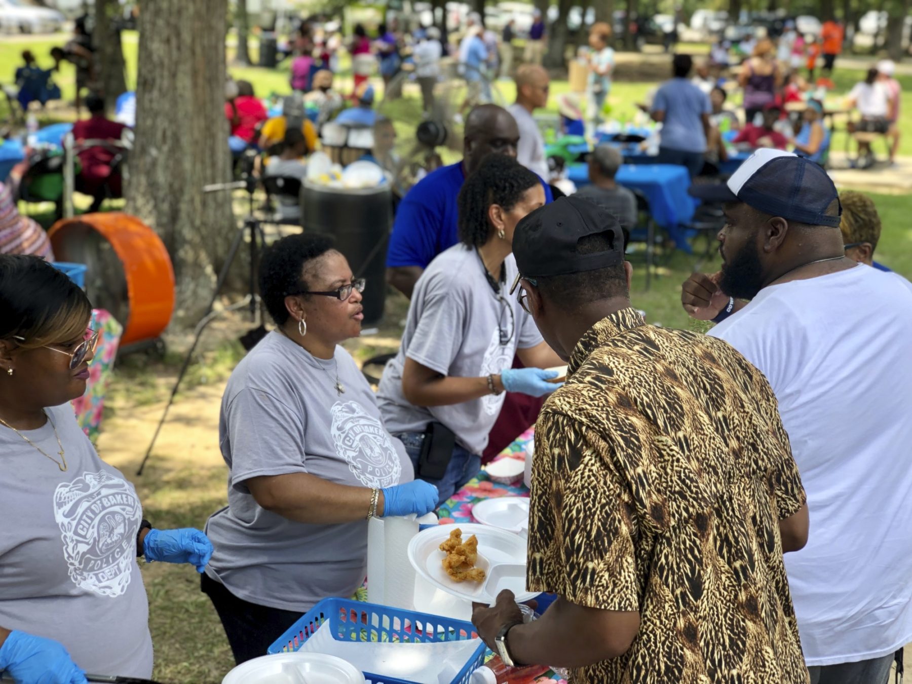 A woman serves food to a crowd