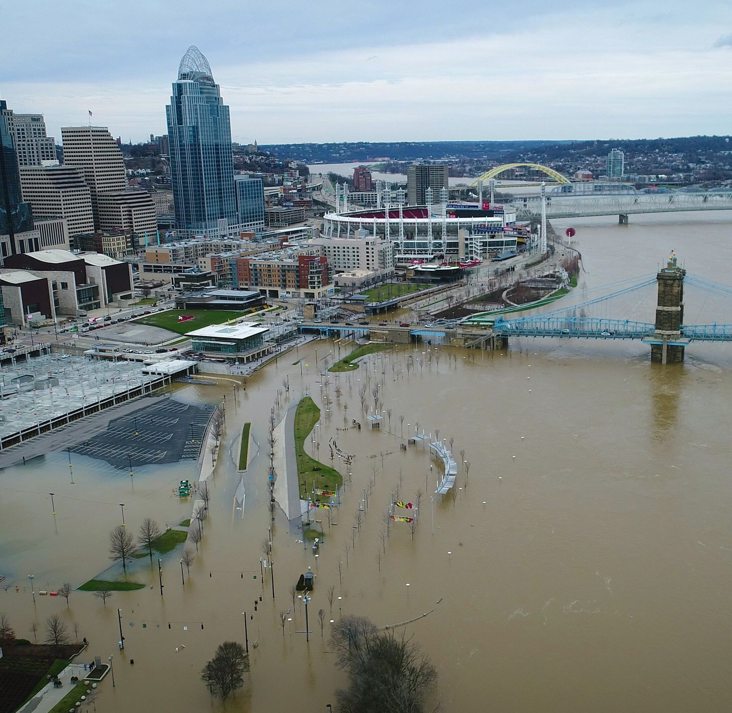 Image of brown Chicago River flooding park