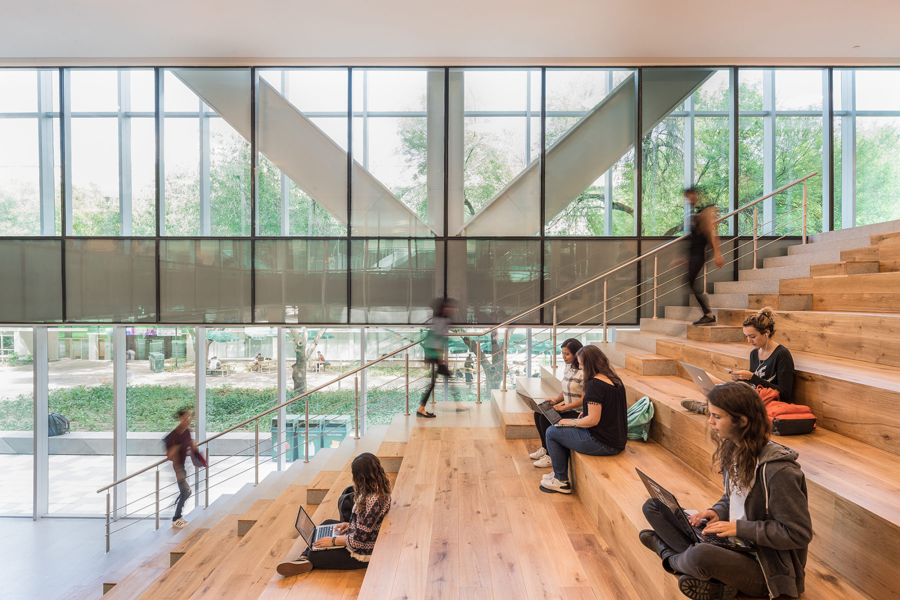 students sitting on staircase